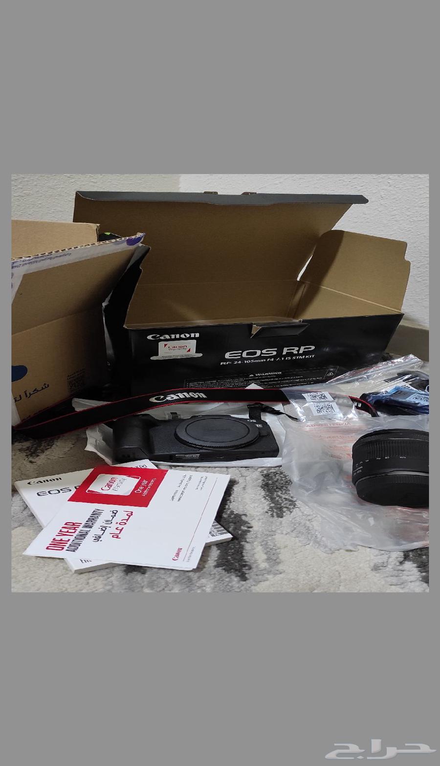 Canon RP camera with its lens, charger, and battery, new in box64452997517185110