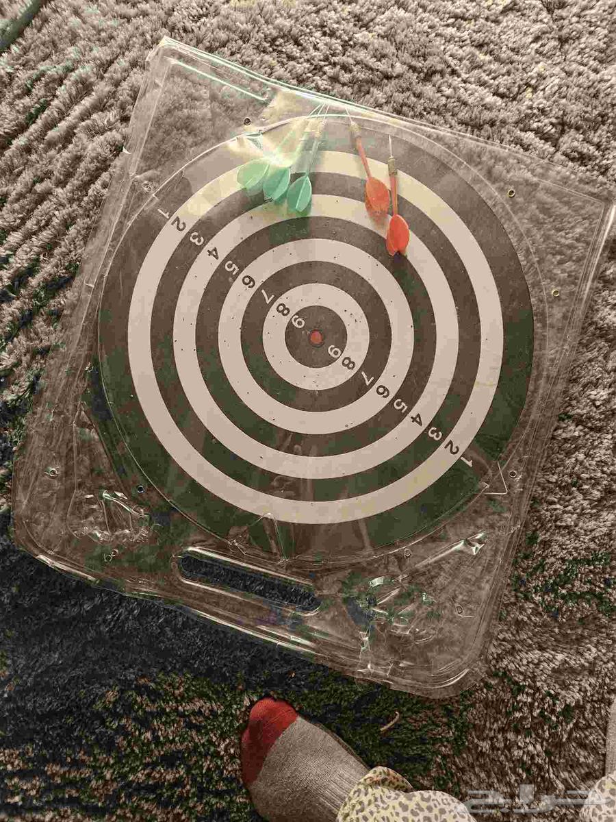 A children's bike that kids and adults can play on, a dartboard game64451606449795111