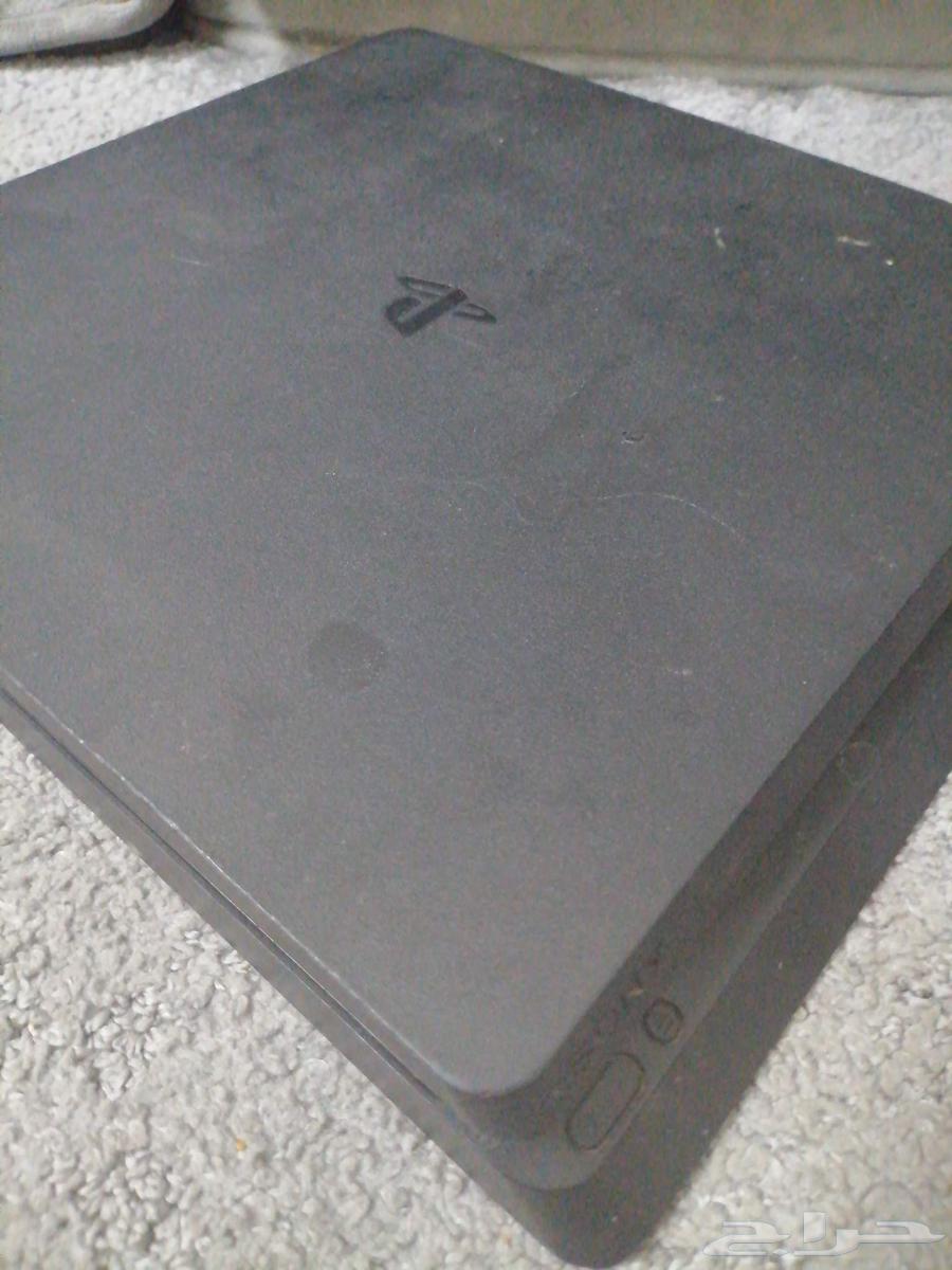 PlayStation 4 with 2 controllers, charger, cables, and tapes64454936447617113