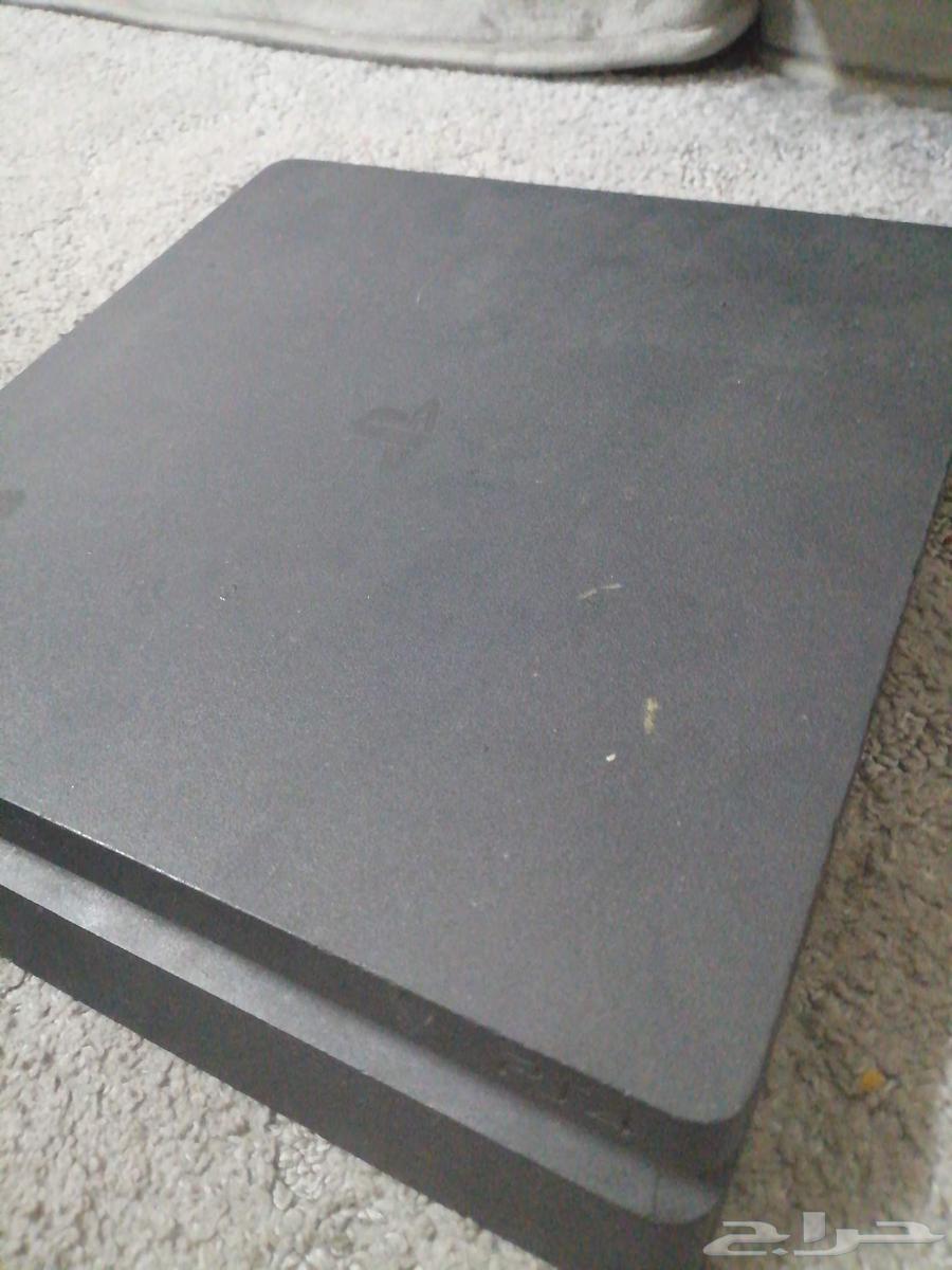 PlayStation 4 with 2 controllers, charger, cables, and tapes64454936447617112