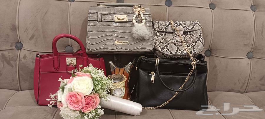 Three bags and one shoe, one of which is new and unused with a bride's hand fan64453421341057110