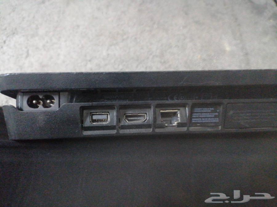 PlayStation 4 with 2 controllers, charger, cables, and tapes64454936447617114