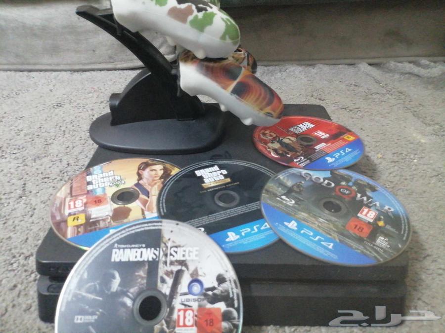 PlayStation 4 with 2 controllers, charger, cables, and tapes64454936447617110