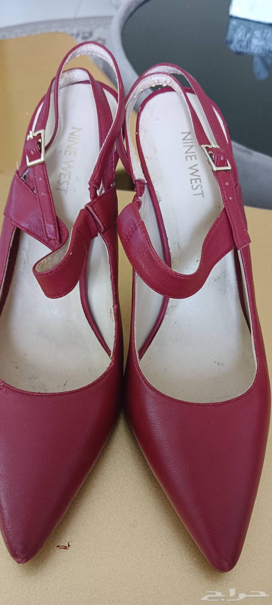 Three bags and one shoe, one of which is new and unused with a bride's hand fan64453421341057113