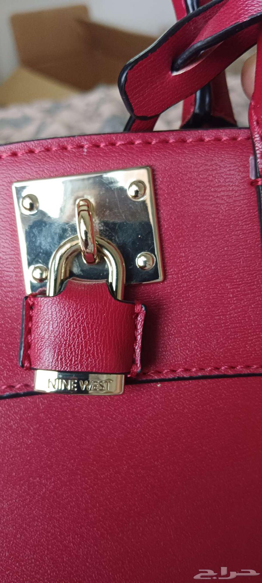 Three bags and one shoe, one of which is new and unused with a bride's hand fan64453421341057111